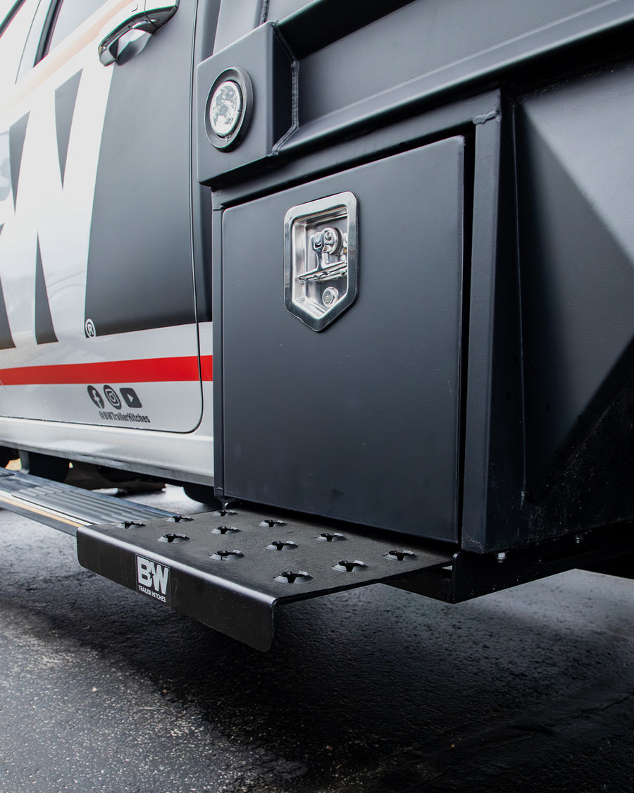 A B&W Trailer Hitches truck underbody retractable step on a work truck.