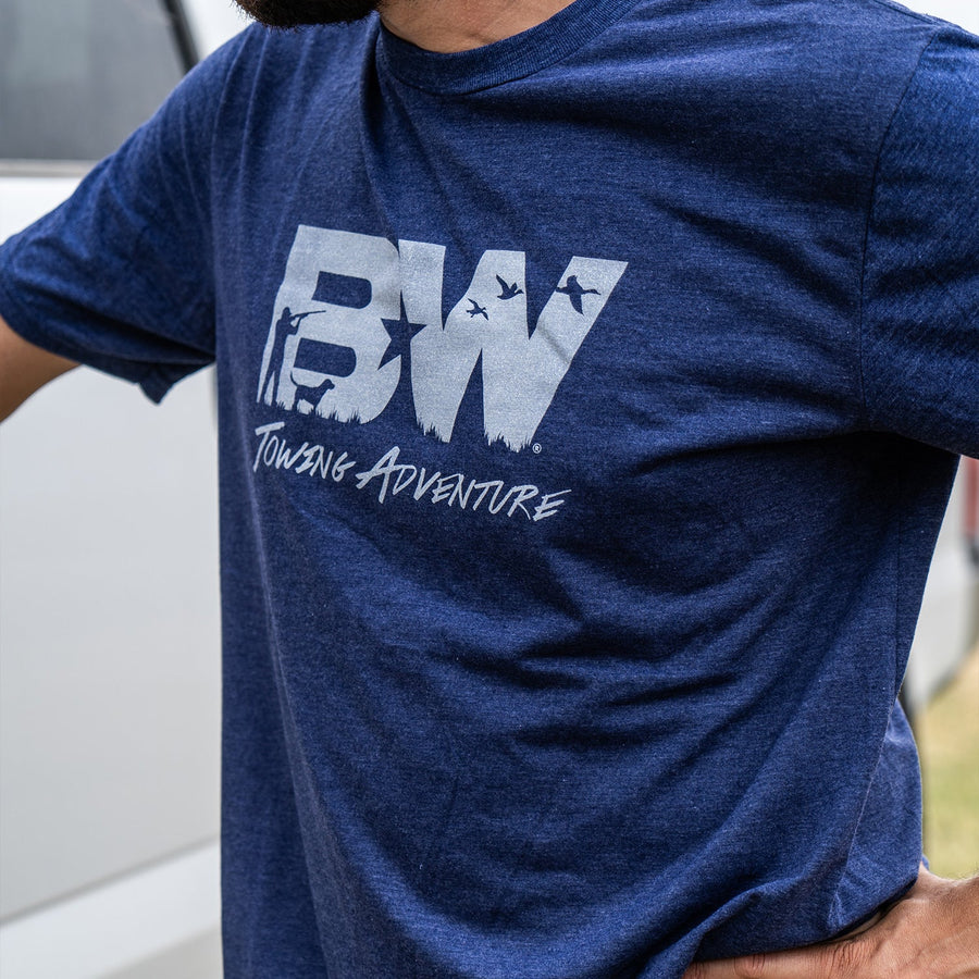 Person wearing a blue t-shirt with 'BW Towing Adventure' logo.