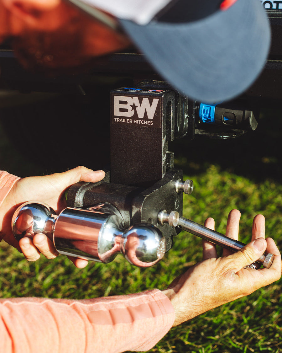  B&W Trailer Hitches stainless steel receiver lock inserted into a 2", 2.5", & 3" receiver.