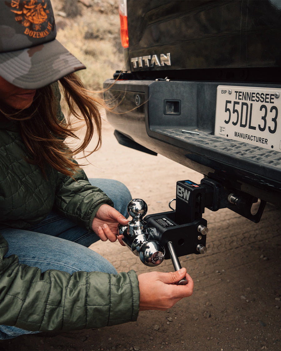 B&W Trailer Hitches stainless steel pin being inserted into a Tow & Stow.
